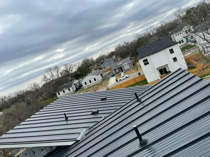 Standing seam metal roof panels with vents for Skylight Repair in Edwardsville